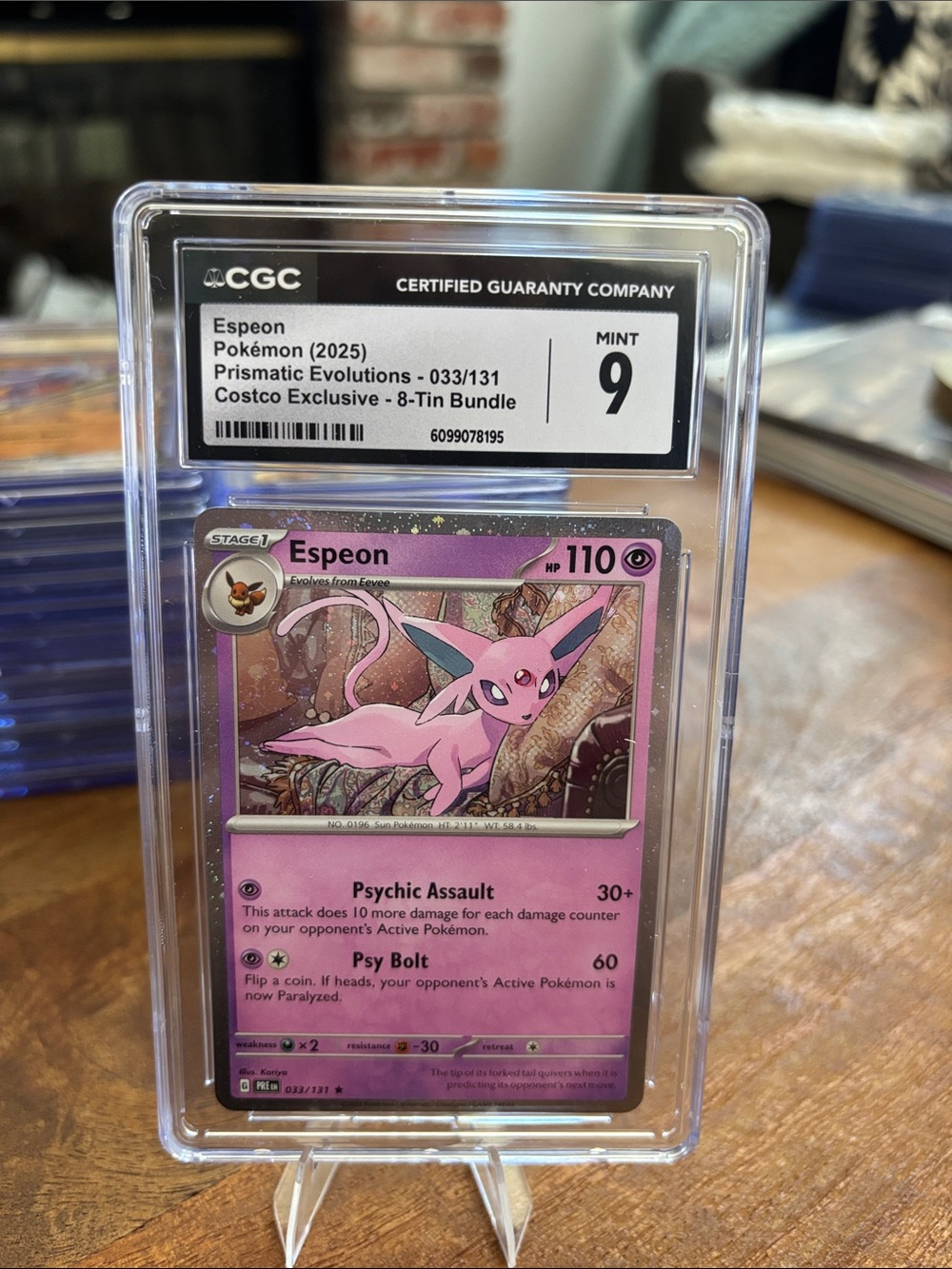 CGC 9 Espeon Holo Costco Exclusive 8 Tin Pokemon Prismatic Evolutions 033/131
